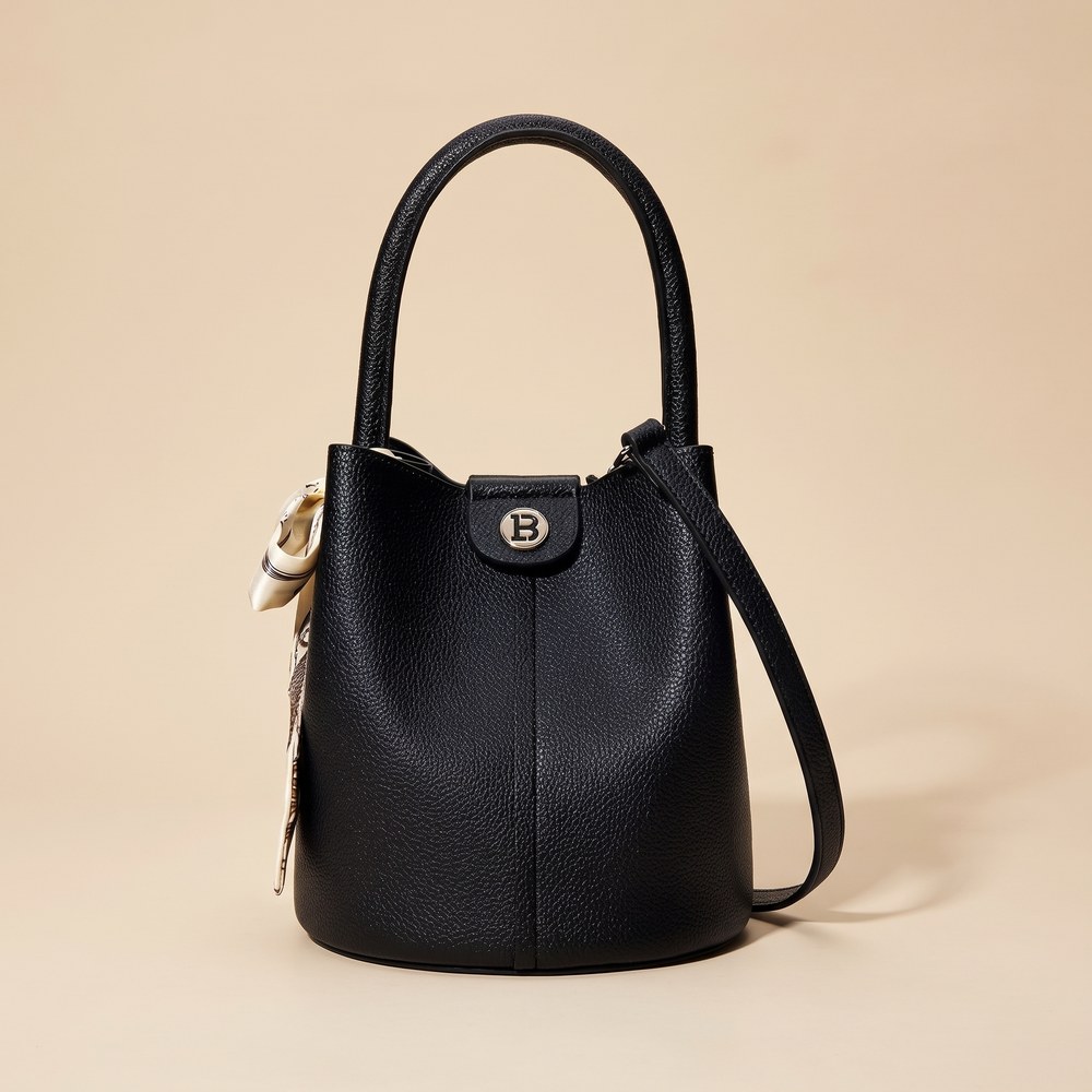 Black pebbled leather bucket bag with a gold clasp