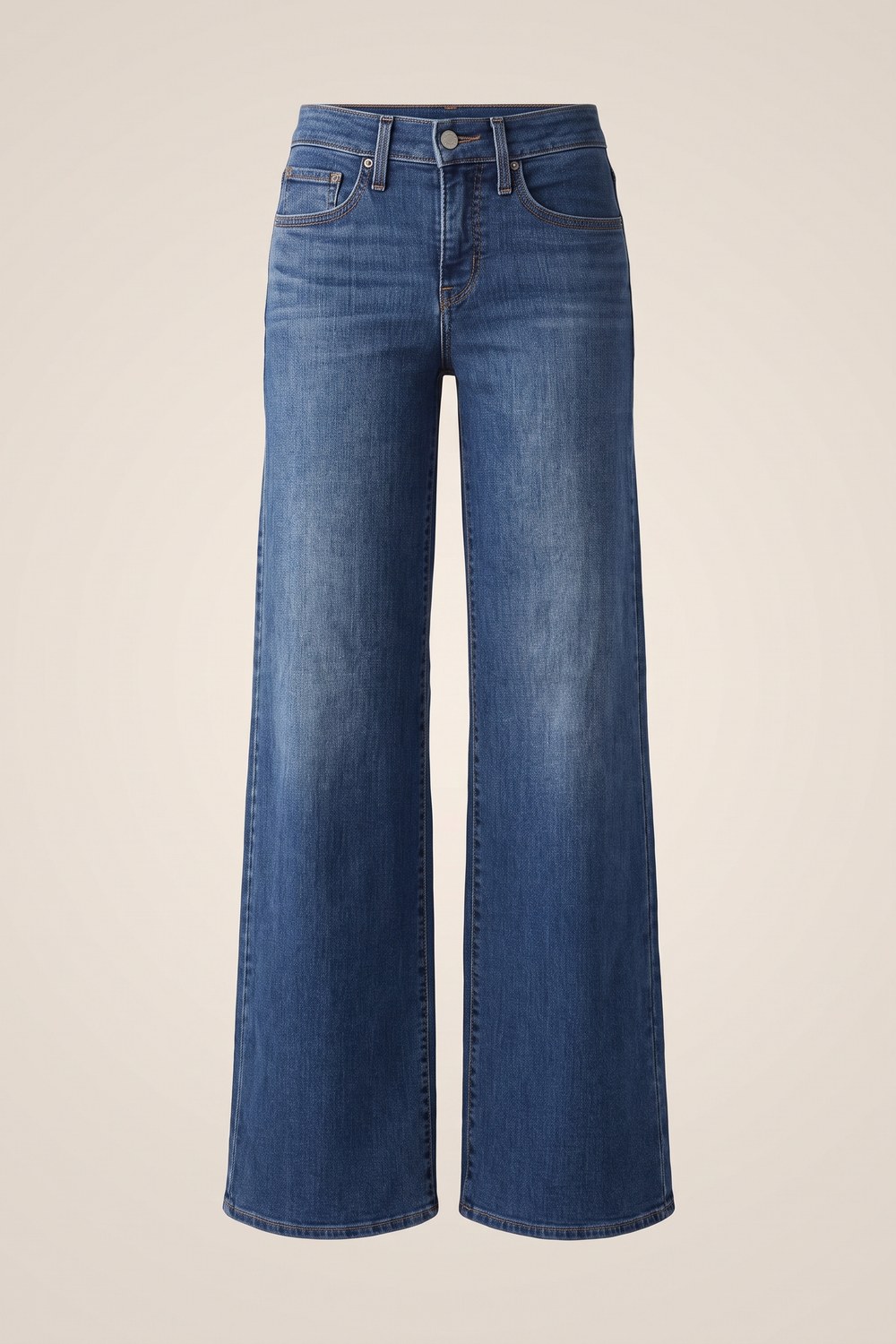 Wide leg jeans for women over 50 in a faded blue wash
